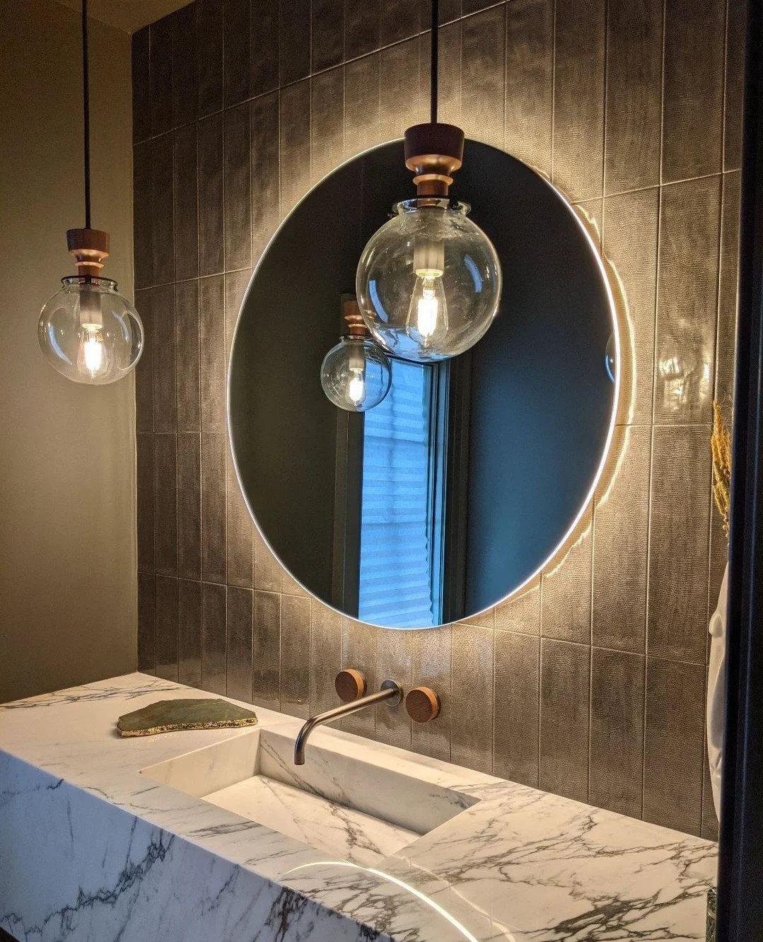 Where light becomes an architectural element.⁠
A sculptural stone vanity, softly backlit mirror, and warm metal accents come together to create a moment of quiet luxury&mdash;layered, intentional, and deeply atmospheric.⁠
⁠
#RSMannino #InteriorArchit