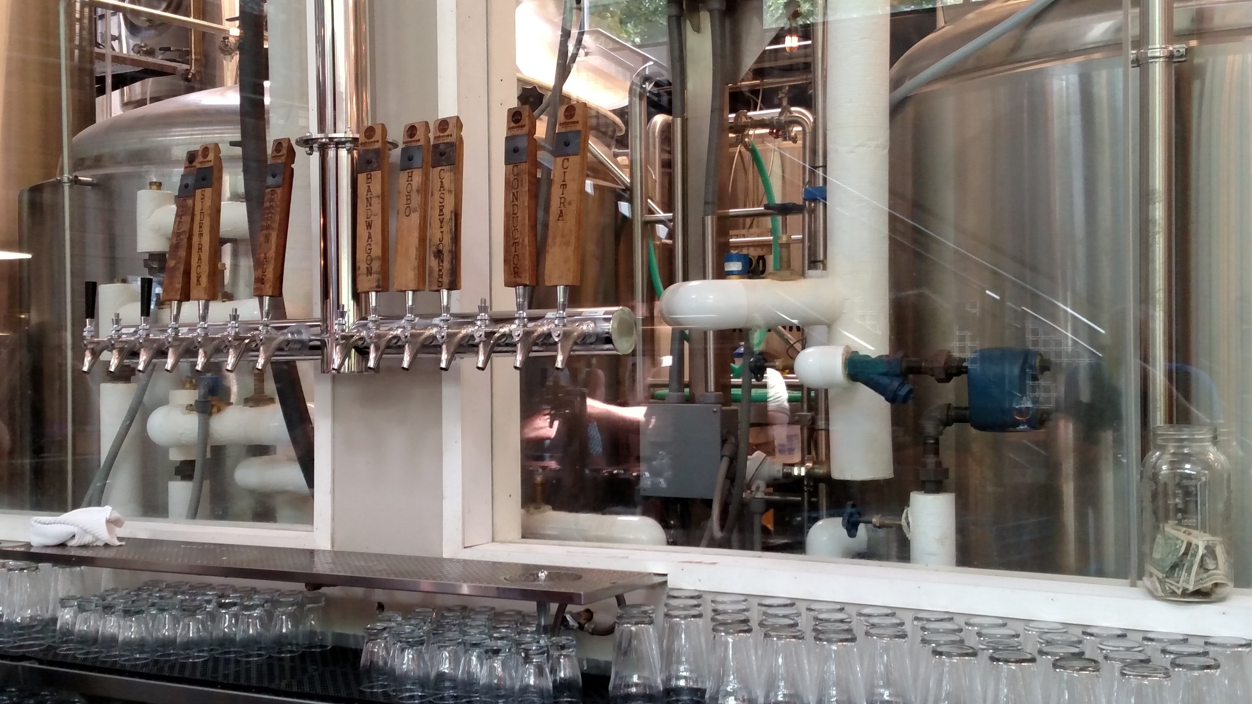 The taps, and a great view of the brewery behind