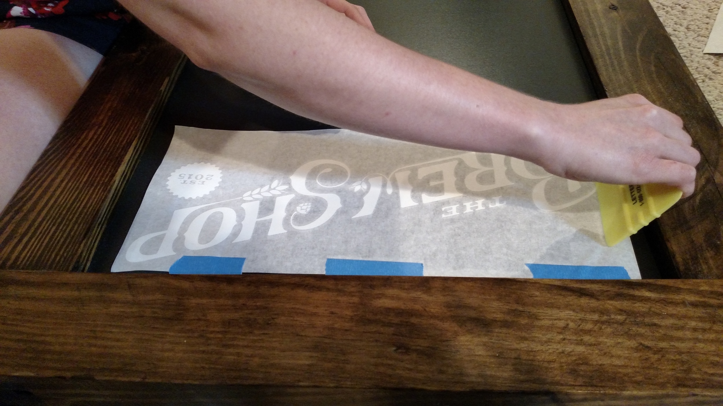 Putting vinyl lettering onto our custom-built sidewalk sign (Thanks, Brew Hubby Mike!)