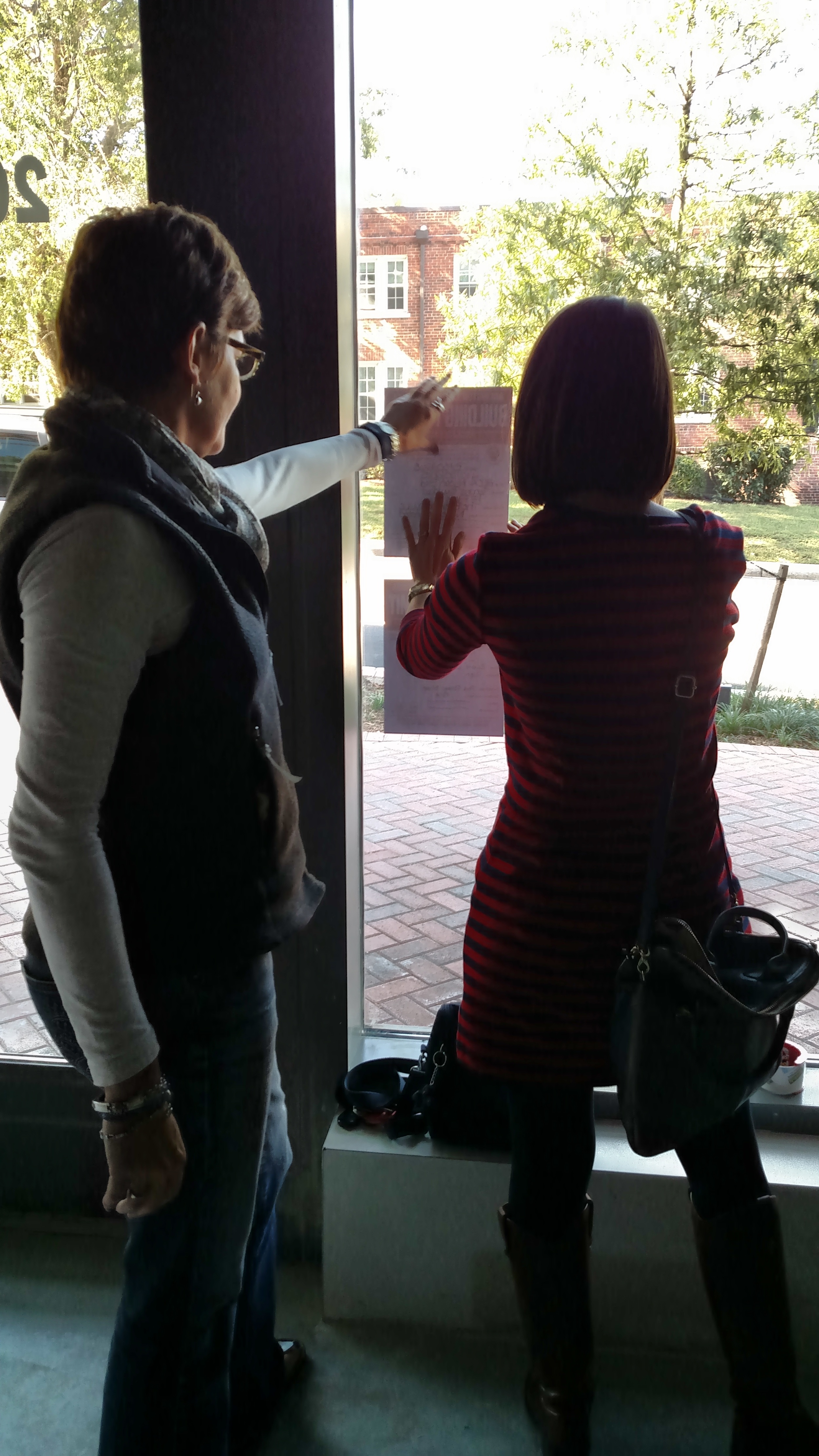 Hanging approved permits with our architect, Susan