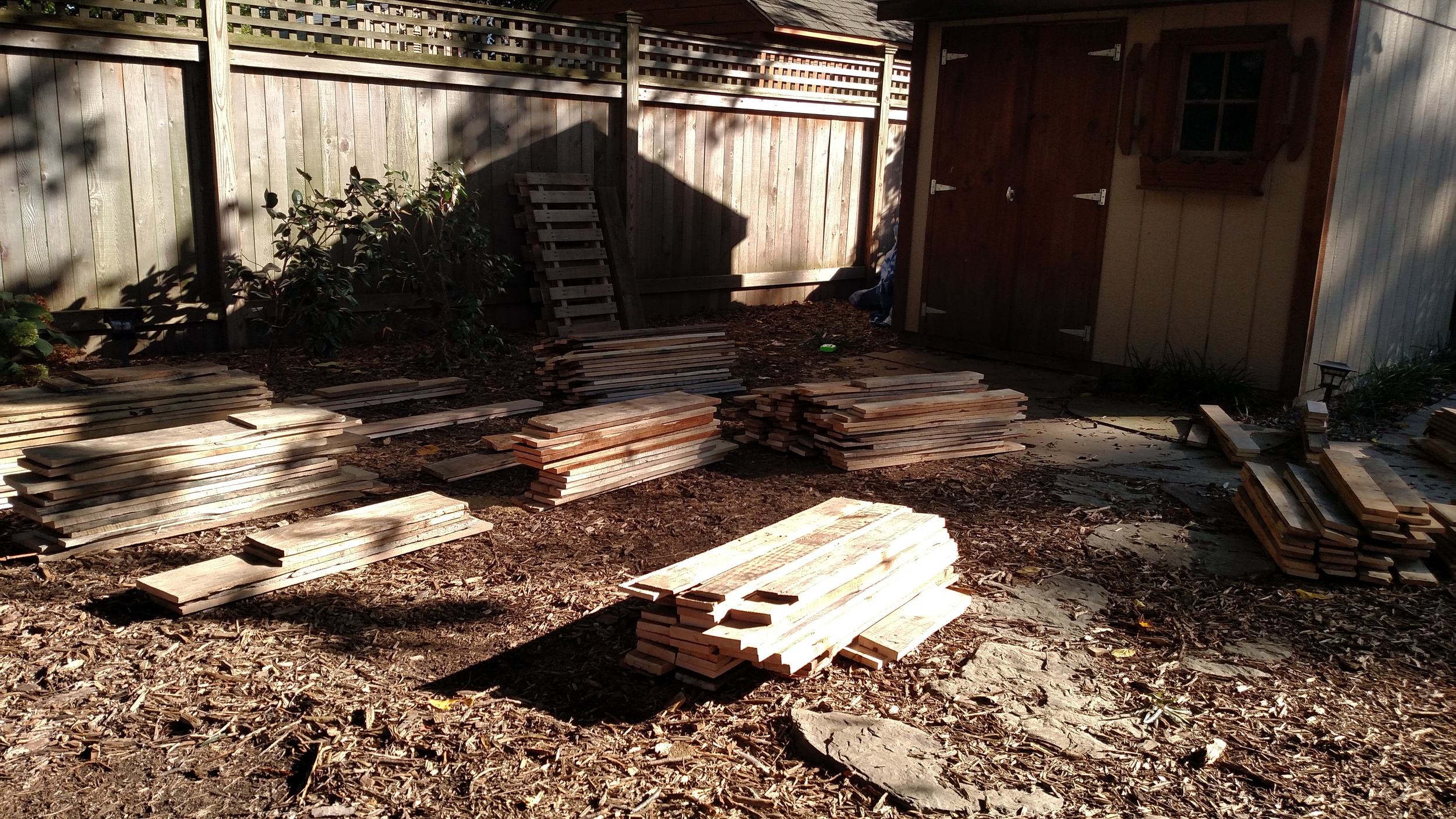 Organizing the pallet wood into piles by size