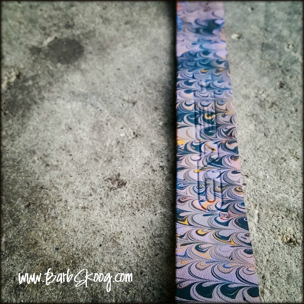 Marbled leather strap.