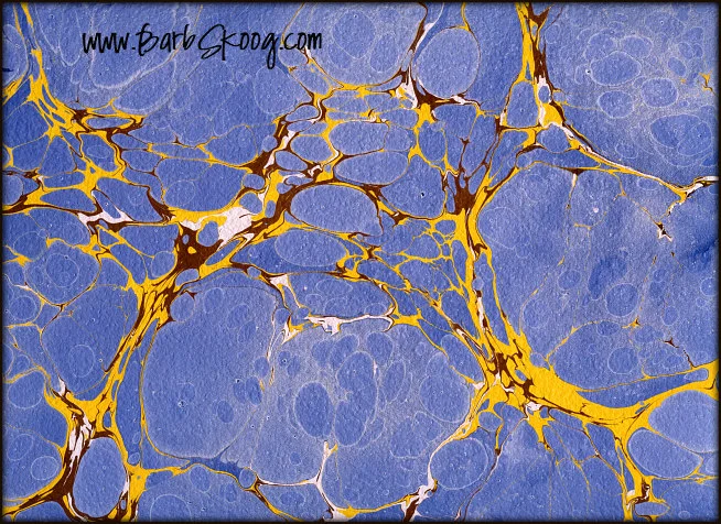 Here I created large color blocks using blue transparent paint to allow the texture of the paper to come through which had the added effect of making the paper feel "watery."