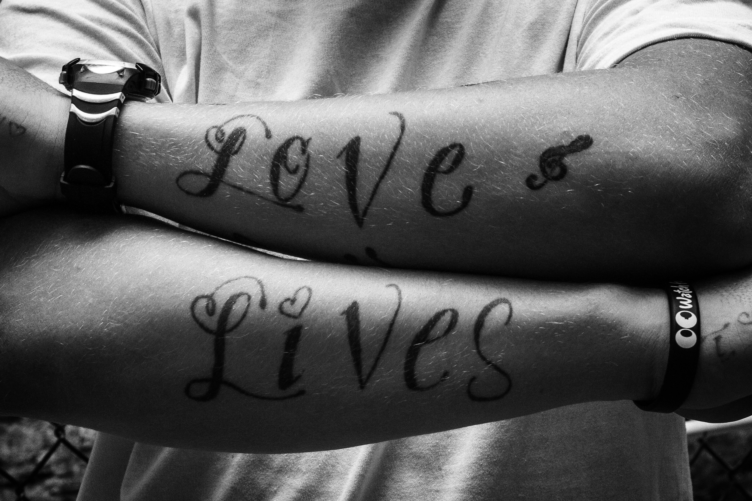 LOVE LIVES. LOVE LIVES Tattoo on Tim. Hunts Point, the Bronx, NYC. August 2012.