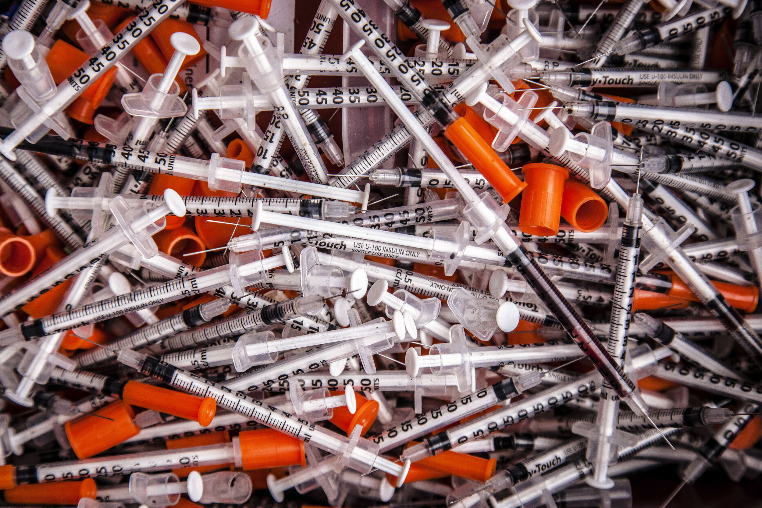 Syringes pile up.