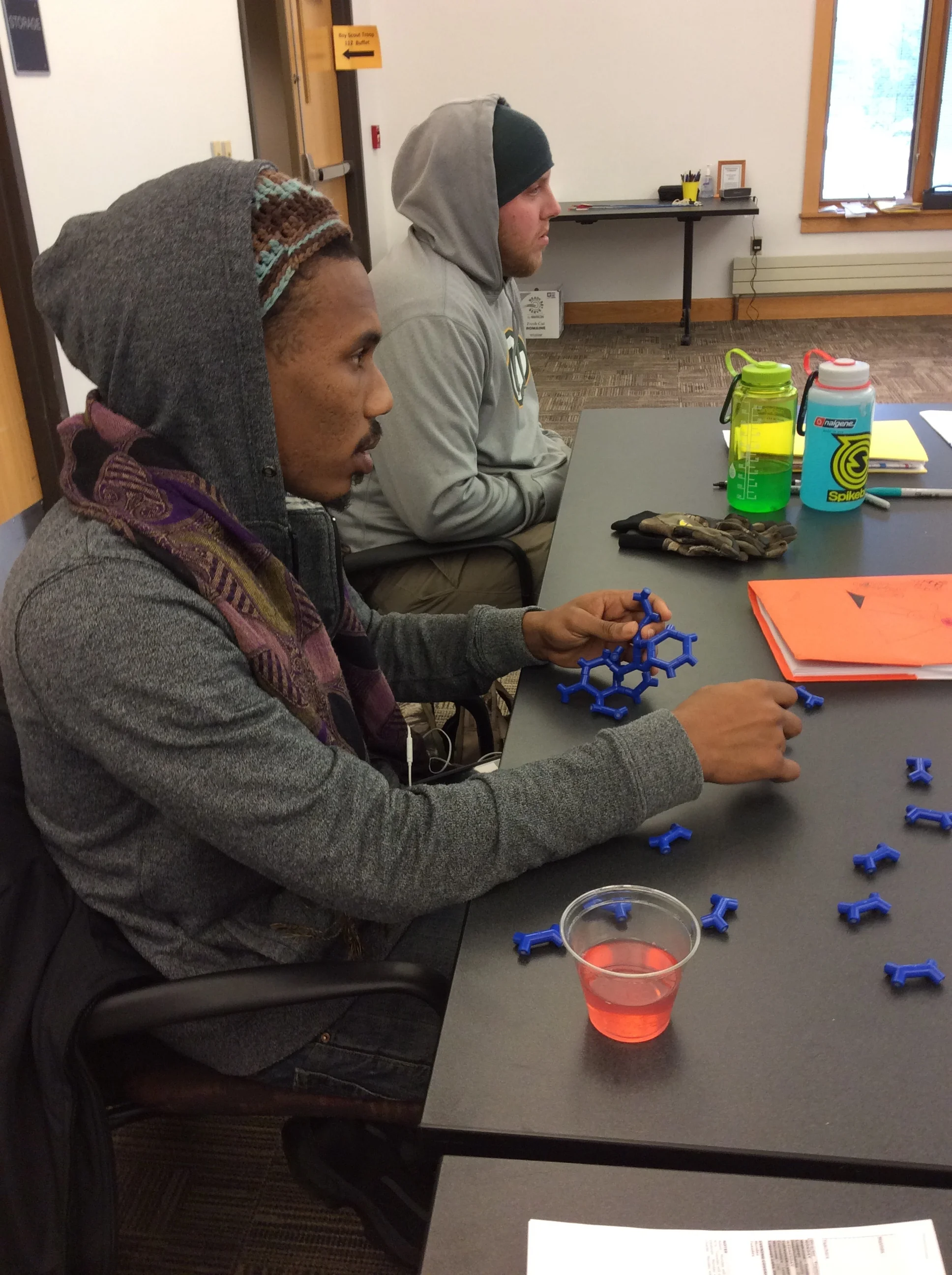 Sherman Lake YMCA spring staff enabling focus by fidgeting. Photo by Karen Christopherson.