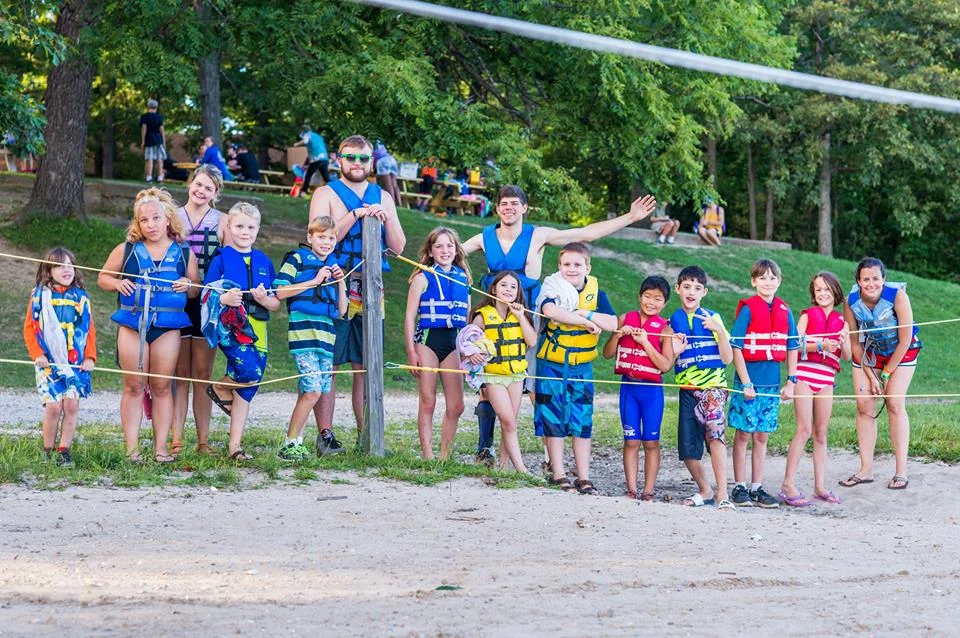 With my campers in the this summer getting ready for a pontoon boat ride at Camp Tall Tree (siblings program)!