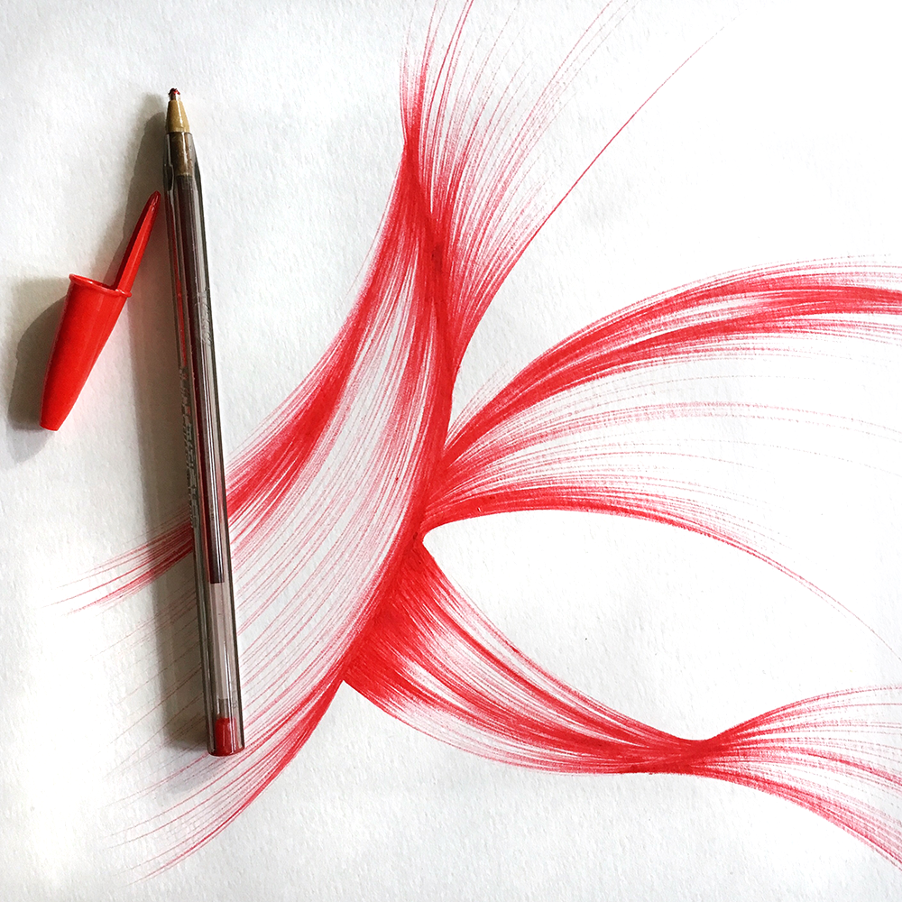 The first marks of my 12" x 18" abstract ink drawing. I started with the red.