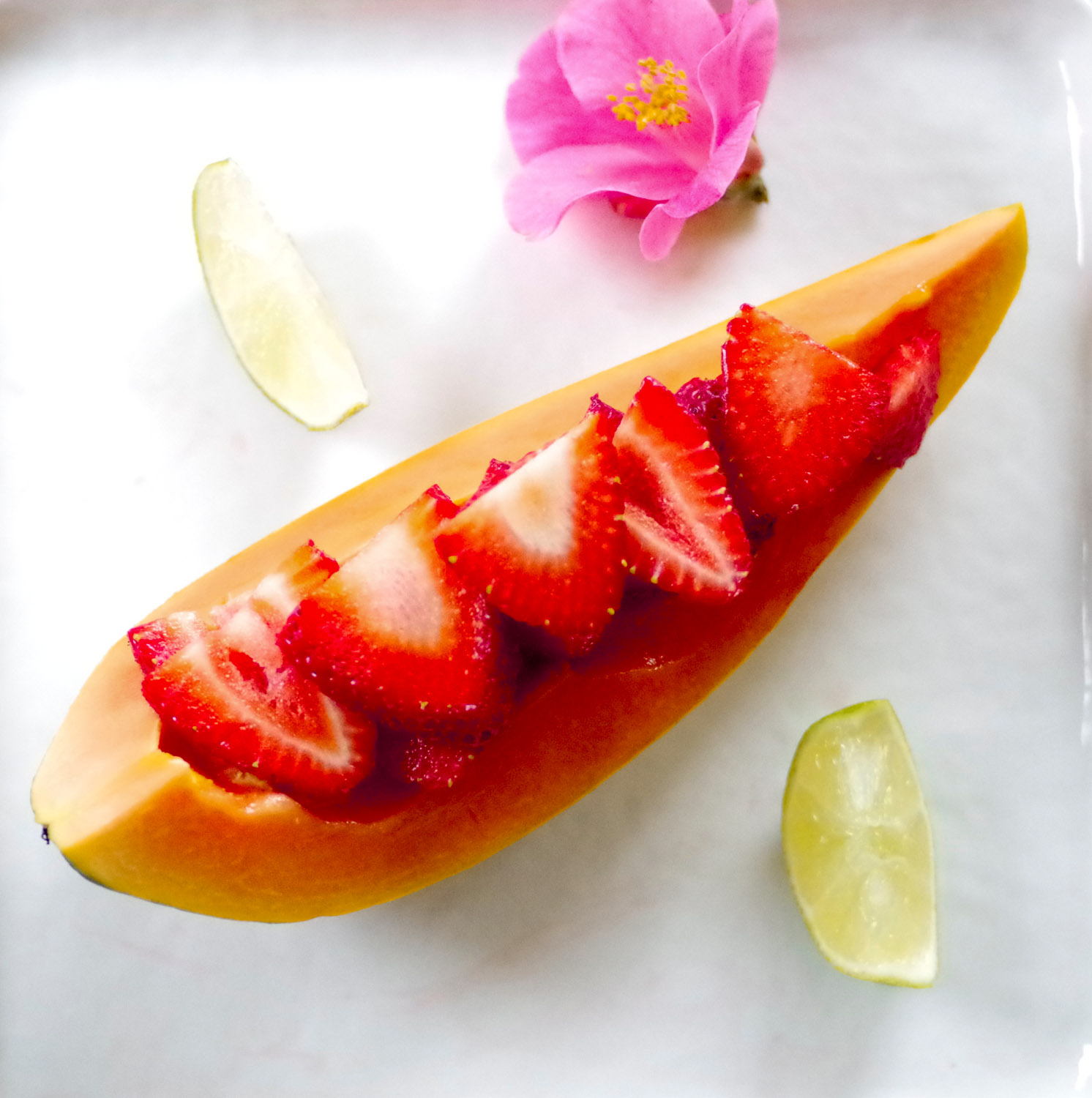Strawberry papaya boat. The papaya's flavor comes alive when lime is squeezed over it.