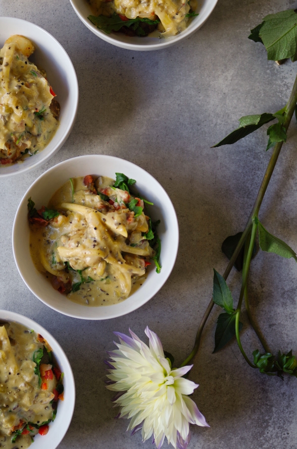 Bowls of Loaded Breakfast Potato, the ultimate comfort food. With vegan cheese.
