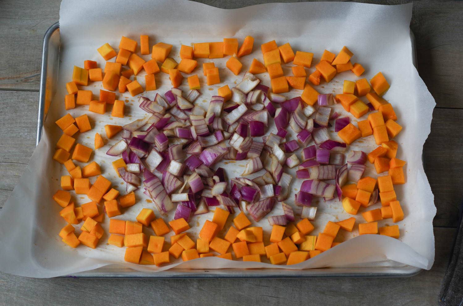 Butternut squash and red onion ready for roasting.