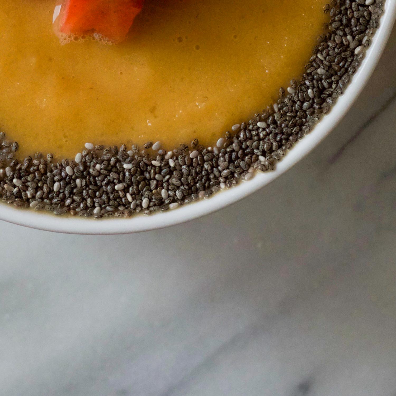 SUNNY SMOOTHIE BOWL TOPPED WITH CHIA SEEDS BY BEAUTIFUL INGREDIENT