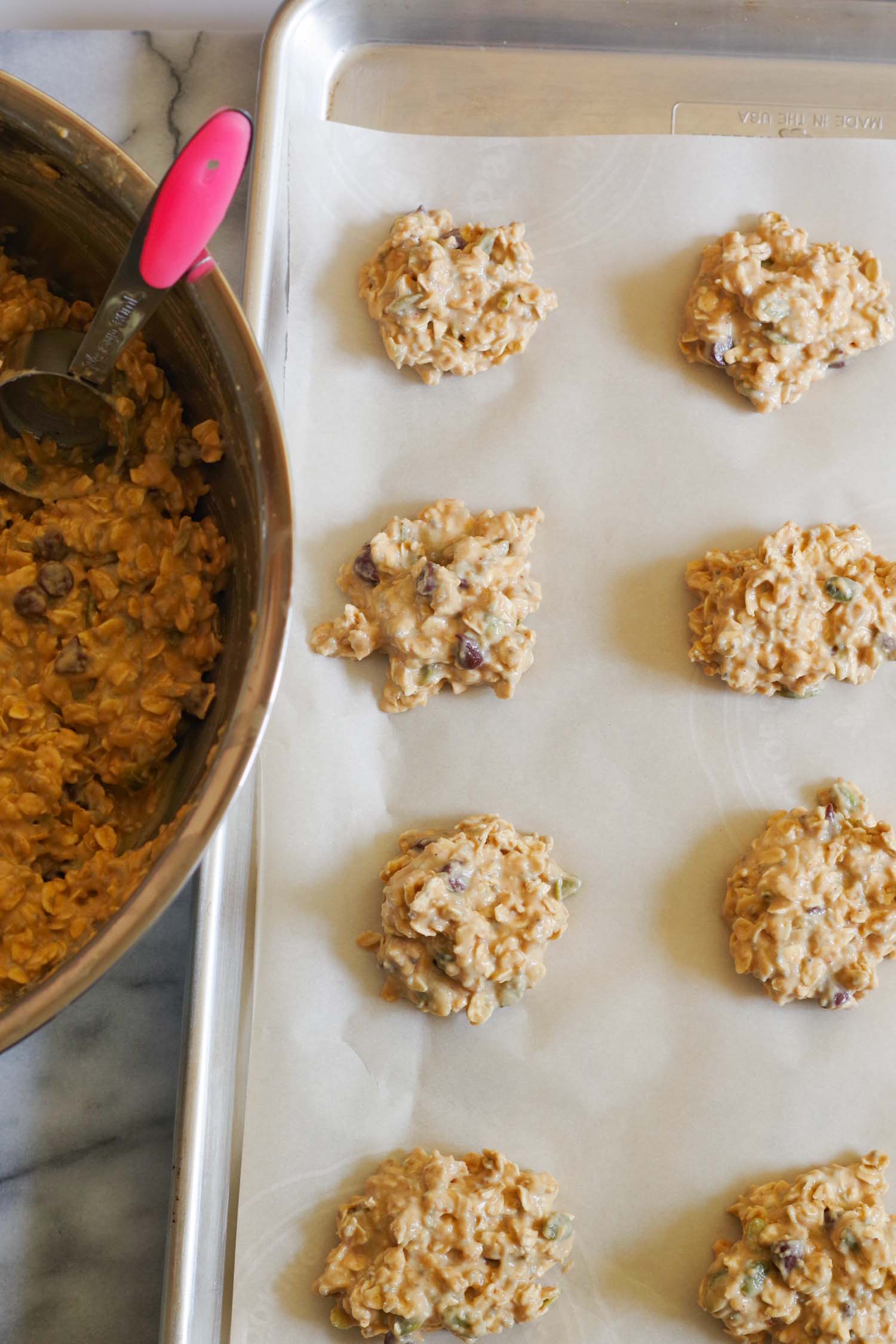 4. Use a ⅛ cup scoop (2 tablespoons) to form cookies. - 