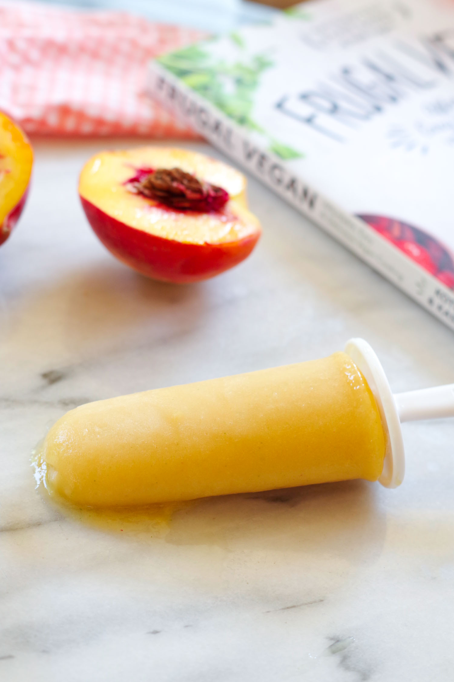 Coconut peach popsicle recipe from the cookbook, Frugal Vegan. Photo by Beautiful Ingredient.