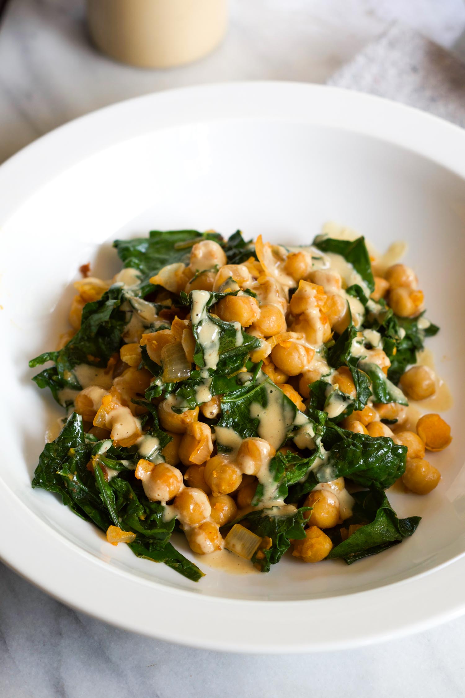 Smoky Kale and Chickpeas with Miso Peanut Drizzle, from  Bold Flavored Vegan Cooking.  Photo by Beautiful Ingredient.