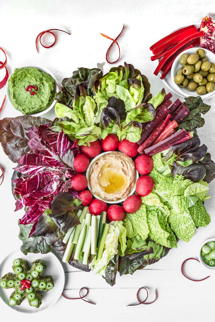 Easy Red &amp; Green Christmas Holiday Veggie Platter with Vegan Arugula-Pecan Cheesy Spread, Power Greens Guacamole, and Hummus. Recipes and photo by Kari of Beautiful Ingredient. #vegan #plantbased #crudite #veggieplatter #redandgreen #christmas #holiday #appetizer #veggies #cheeseboard #partytray
