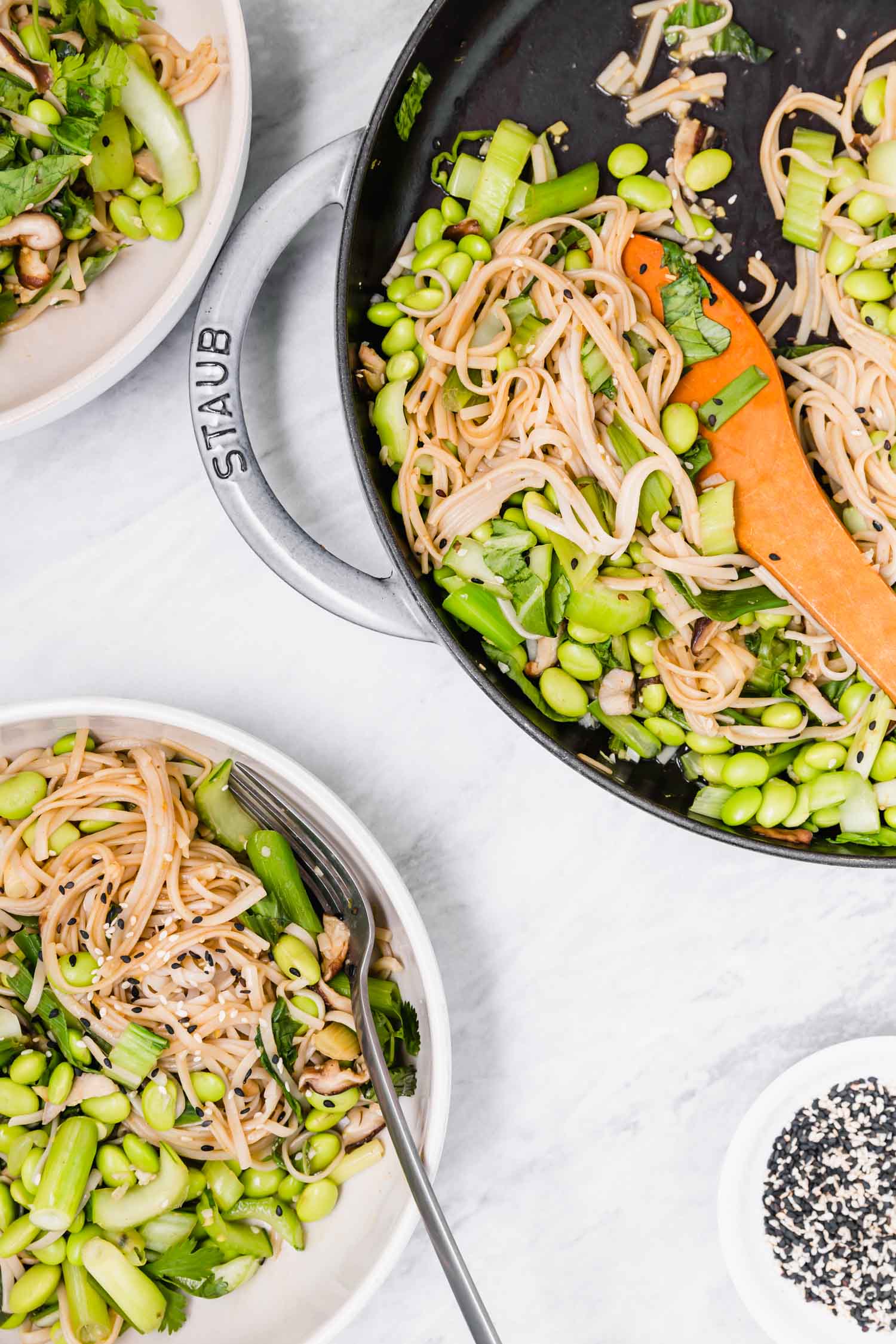 Edamame and Bok Choy Sauté with Rice Noodles and Miso Lime Sauce    is plant-based, quick (ready within 30 minutes from chopping to plating), easy, gluten-free, oil-free, nut-free, veggie-packed (with three servings of veg per person - including one cruciferous), satisfying (with a serving of beans per person), and great all year round, especially during the fall/winter seasons. #vegandinner #ricenoodles #misosauce #wfpb #dinner #plantbased #edamame #bokchoy