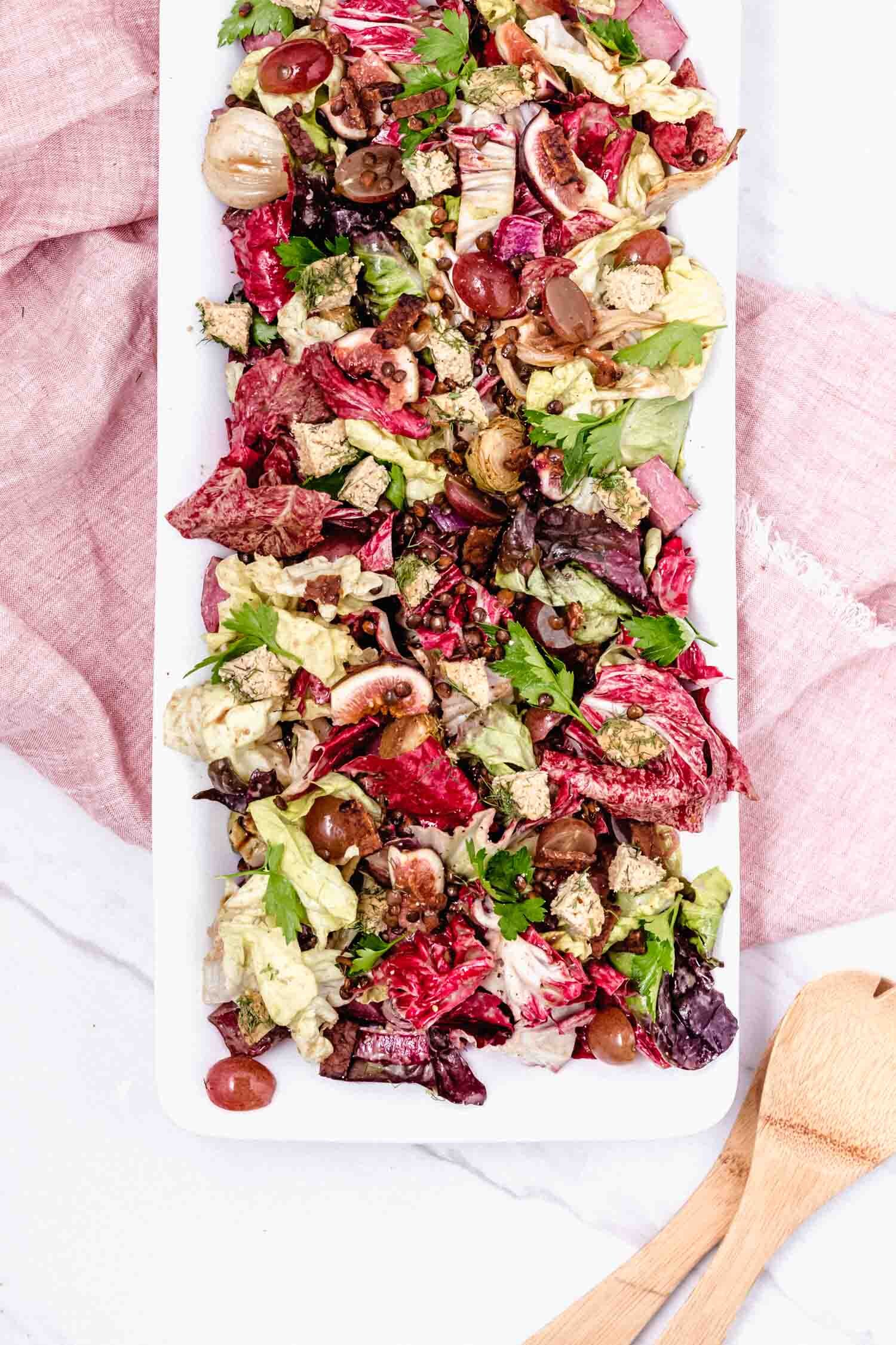 Radicchio Harvest Salad with Pecan Dressing (Vegan, GF) is a full holiday meal in itself, yet makes a crowd-pleasing plant-based addition to a holiday spread. #veganholiday #plantbasedrecipe #thanksgiving #christmas #holidaysalad #radicchio #vegancheese #lentils #wildrice #veganbacon #figrecipe #pecan #vegansalad #harvestsalad #thanksgivingsalad #colorfulsalad #glutenfreeholiday
