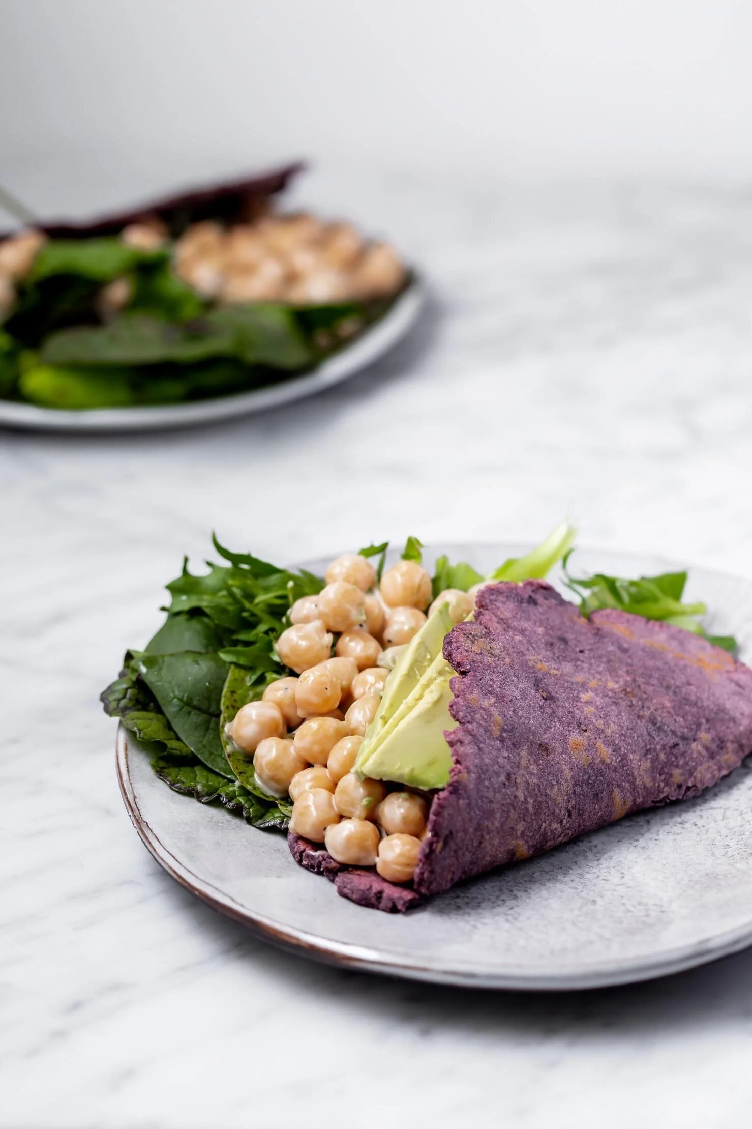These Easy Potato Flatbreads only require two pantry staple ingredients and make great wraps, tortillas, naan, and pizza crust. By Kari of Beautiful Ingredient. #flatbread #homemade #potato #twoingredientrecipe #easyrecipe #vegan #glutenfree #nutfree #yeastfree #tortilla #purple #pizzacrust #naan #quickbread