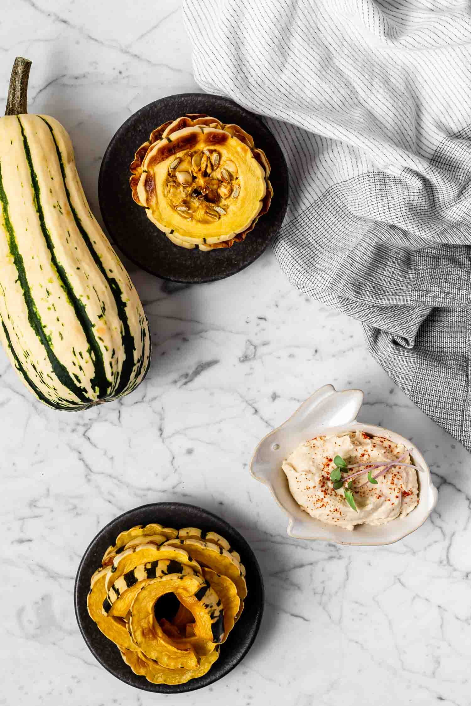 Delicata Dippers, a one-ingredient satisfying snack that takes just 5 minutes to prepare, are cooked and ready to eat within 25 minutes, and taste wonderful dipped in hummus or another savory dip. While a carrot or celery stick might not replace chips or crackers easily, these will! They’re filling and great for weight loss. Make rainbow shapes or leave them as rounds to enjoy the toasted seeds. #delicata #squash #weightloss #snack #weightlosssnacks #easyrecipe #oneingredientrecipe #readyin30minutes #wholefoodsnack #chipreplacement #crackerreplacement