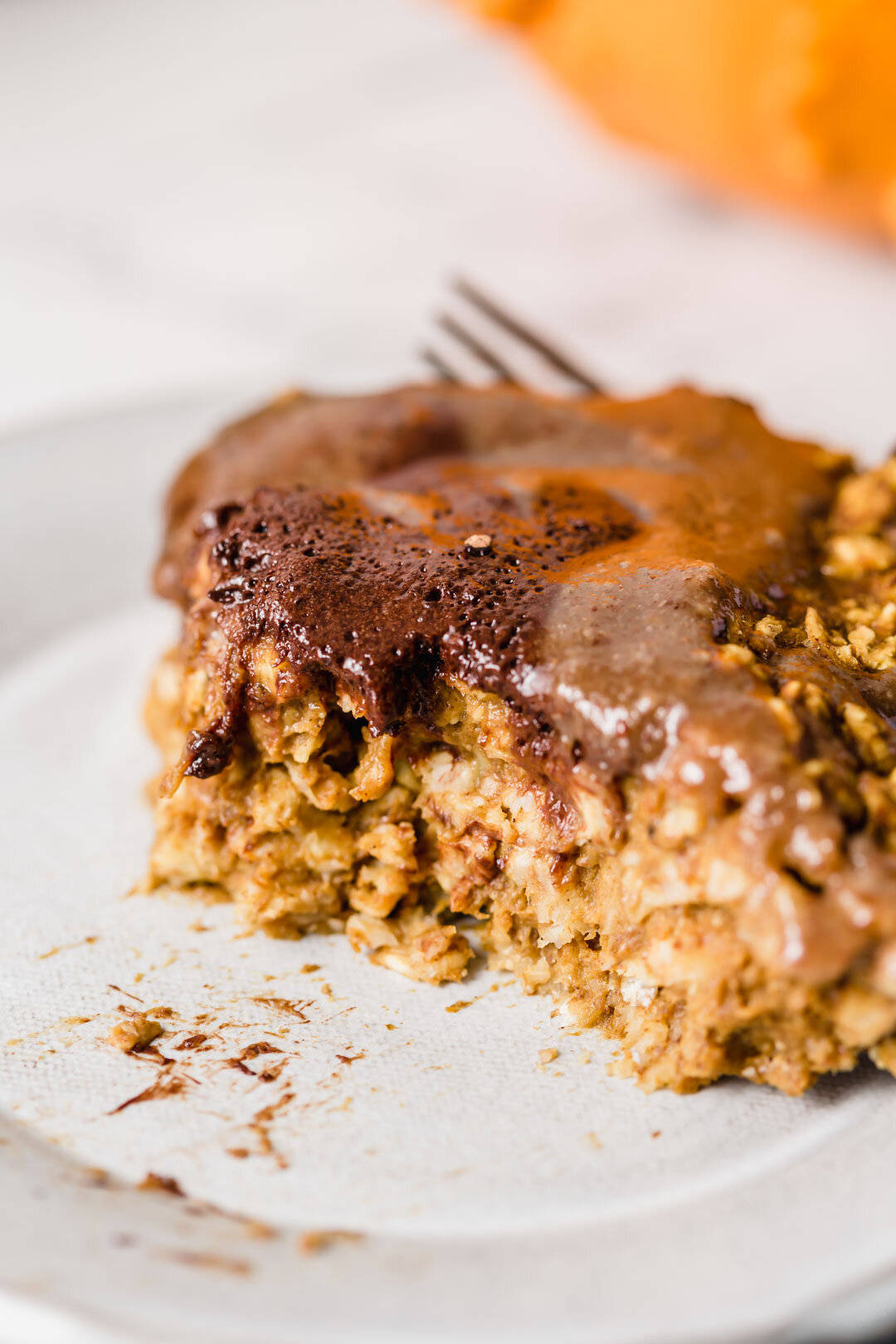 Vegan Pumpkin Chocolate Swirl Baked Oatmeal Pudding with Maple Pecan Sauce. By Kari at Beautiful Ingredient. Eat it by the gooey slice like bread pudding. Why you’ll love this recipe: Little effort is required. Ready in 30 minutes. Most people can eat it as it’s vegan, gluten-free, oil-free, refined sugar-free. Nutrient dense and delicious. Big batch makes enough for leftovers. Pumpkin spice + chocolate + maple pecan sauce oh my! If you’re missing a few ingredients, I’ve included options to still make it delicious. #bakedoatmeal #bakedoatmealrecipes #vegan #breakfastideas #veganbreakfast #veganbreakfastrecipes #veganrecipe #glutenfree #glutenfreebaking #refinedsugarfree #oilfree #chocolate #pumpkinspice #pumpkinrecipes #30minutesorless