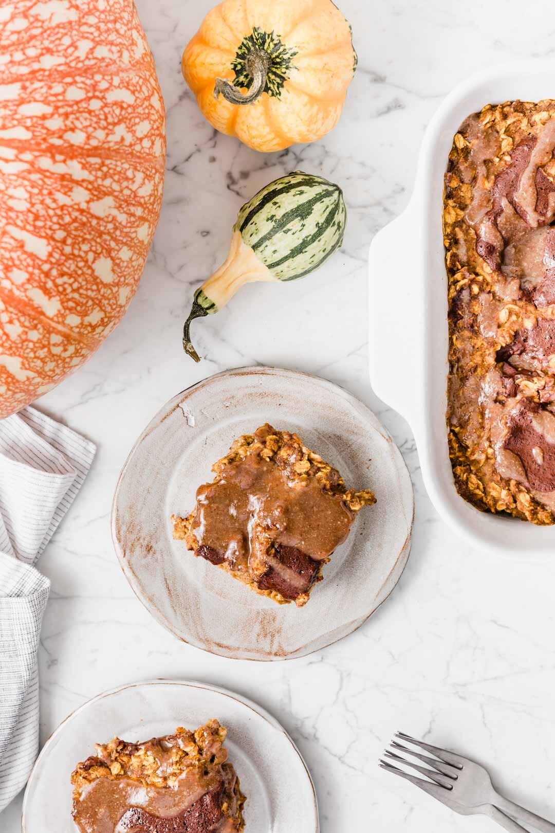 Vegan Pumpkin Chocolate Swirl Baked Oatmeal Pudding with Maple Pecan Sauce. By Kari at Beautiful Ingredient. Eat it by the slice. Why you’ll love this recipe: Little effort is required. Ready in 30 minutes. Most people can eat it as it’s vegan, gluten-free, oil-free, refined sugar-free. Nutrient dense and delicious. Big batch makes enough for leftovers. Pumpkin spice + chocolate + maple pecan sauce oh my! If you’re missing a few ingredients, I’ve included options to still make it delicious. #bakedoatmeal #bakedoatmealrecipes #vegan #breakfastideas #veganbreakfast #veganbreakfastrecipes #veganrecipe #glutenfree #glutenfreebaking #refinedsugarfree #oilfree #chocolate #pumpkinspice #pumpkinrecipes #30minutesorless