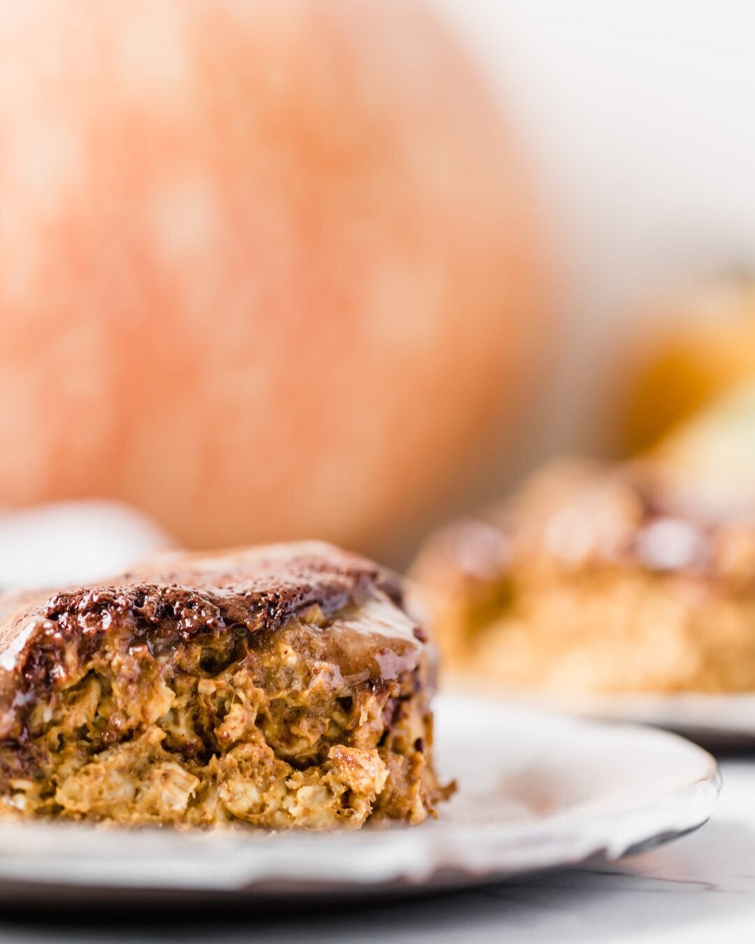 Vegan Pumpkin Chocolate Swirl Baked Oatmeal Pudding with Maple Pecan Sauce. By Kari at Beautiful Ingredient. Eat it by the slice or by the bowl. Why you’ll love this recipe: Little effort is required. Ready in 30 minutes. Most people can eat it as it’s vegan, gluten-free, oil-free, refined sugar-free. Nutrient dense and delicious. Big batch makes enough for leftovers. Pumpkin spice + chocolate + maple pecan sauce oh my! If you’re missing a few ingredients, I’ve included options to still make it delicious. #bakedoatmeal #bakedoatmealrecipes #vegan #breakfastideas #veganbreakfast #veganbreakfastrecipes #veganrecipe #glutenfree #glutenfreebaking #refinedsugarfree #oilfree #chocolate #pumpkinspice #pumpkinrecipes #30minutesorless