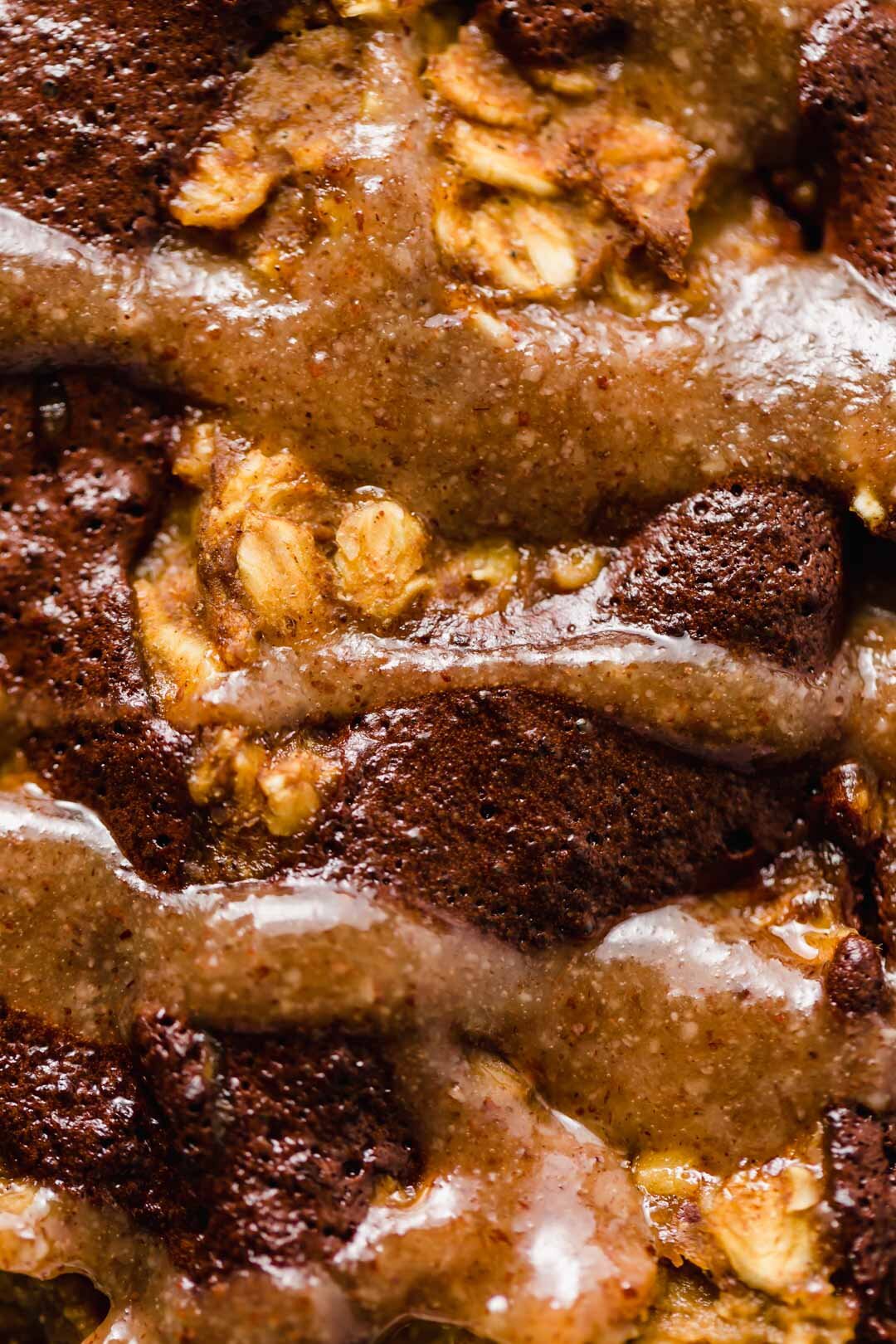 Vegan Pumpkin Chocolate Swirl Baked Oatmeal Pudding with Maple Pecan Sauce. Easy, ready in 30 minutes, vegan, gluten-free, oil-free, refined sugar-free, nutrient dense and delicious. Big batch, ingredient options included. #bakedoatmeal #bakedoatmealrecipes #vegan #breakfastideas #veganbreakfast #veganbreakfastrecipes #veganrecipe #glutenfree #glutenfreebaking #refinedsugarfree #oilfree #chocolate #pumpkinspice #pumpkinrecipes #30minutesorless