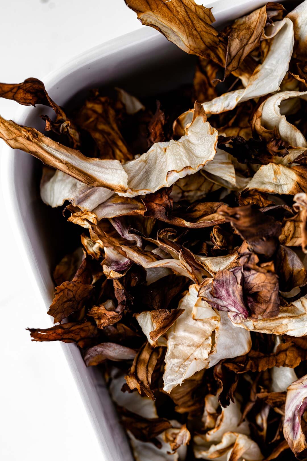 Crispy Roasted Radicchio Strips Recipe, Oil-Free Vegan by Beautiful Ingredient. Ready within 10 minutes in your air fryer! Crispy and bittersweet, these make a great snack or topping. #radicchio #oilfree #oilfreeveganrecipes #radicchiorecipes #roastedveggies #roastedvegetables #airfryer #vegan #plantbased #oneingredientrecipes #winterrecipes #autumnrecipes #fallrecipes