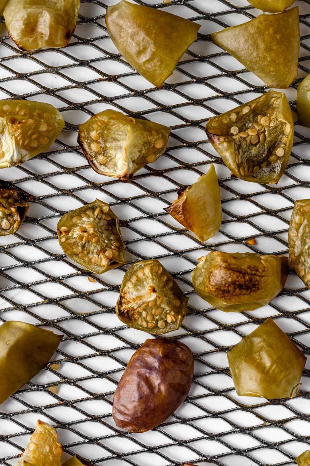 These beautifully golden roasted tomatillos have no oil in the recipe and are so quick and easy to make in the air fryer or oven, adding a beautiful sweet-tart flavor to your dishes, especially bean and potato-based foods. By Beautiful Ingredient.    #tomatillos #tomatillosrecipes #tomatillorecipe #roastedtomatillo #airfryer #tomatillo #airfryerrecipes #vegan #oilfree #oilfreeveganrecipes