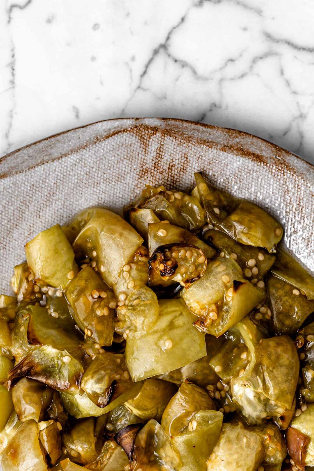 These beautifully golden roasted tomatillos have no oil in the recipe and are so quick and easy to make in the air fryer or oven, adding a beautiful sweet-tart flavor to your dishes, especially bean and potato-based foods. By Beautiful Ingredient.    #tomatillos #tomatillosrecipes #tomatillorecipe #roastedtomatillo #airfryer #tomatillo #airfryerrecipes #vegan #oilfree #oilfreeveganrecipes