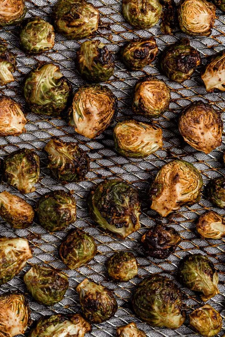 Oil-free Vegan Balsamic Maple Pecan Roasted Brussels Sprouts in the air fryer, with oven option. By Kari of Beautiful Ingredient. #brusselssprouts #airfryer #brusselssproutsairfryer #brusselssproutsrecipe #vegan #glutenfree #oilfree #recipe #veganrecipe #thanksgiving #christmas #holidayrecipe #fallrecipe #beautifulingredient #roastedvegetables #quickrecipe #crispy