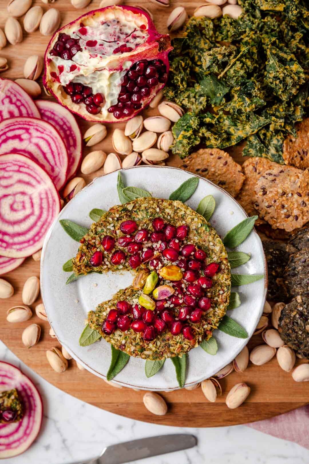Arugula Pecan Vegan Cheesy Spread is an appetizer that satisfies that cheese craving with just six whole-food ingredients - and it’s quick and easy, ready in just 15 minutes! A perfect addition to your next cheese board. Recipe by Kari of Beautiful Ingredient #vegancheeseboard #cheeseballrecipes #vegancheeseball #vegancheesespread #vegancheese #veganrecipes #veganholidayappetizers #veganholidayrecipes #appetizers