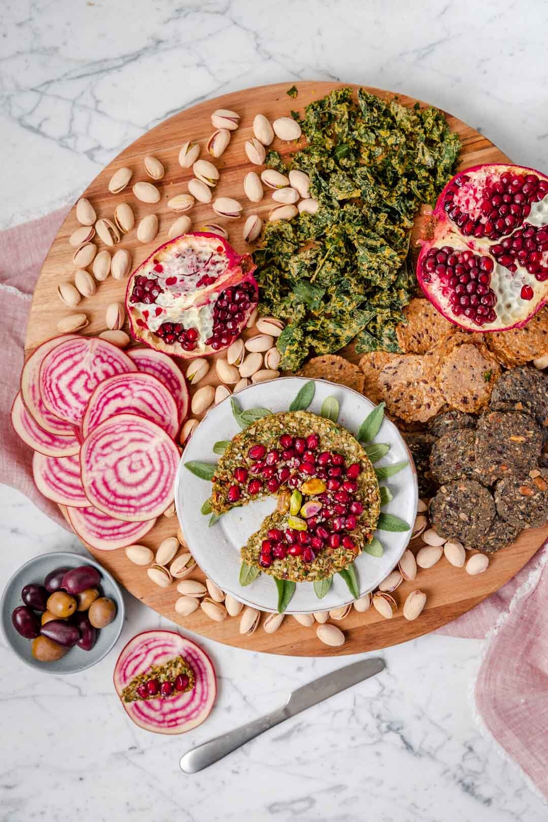 Arugula Pecan Vegan Cheesy Spread is an appetizer that satisfies that cheese craving with just six whole-food ingredients - and it’s quick and easy, ready in just 15 minutes! A perfect addition to your next cheese board. Recipe by Kari of Beautiful Ingredient #vegancheeseboard #cheeseballrecipes #vegancheeseball #vegancheesespread #vegancheese #veganrecipes #veganholidayappetizers #veganholidayrecipes #appetizers