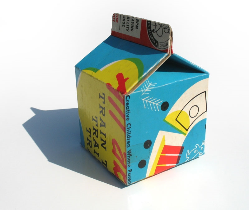  For these little milk carton sculptures I used&nbsp;old record album covers. &nbsp;Taking something that was designed to be viewed flat and folding it into a 3 dimensional object resulted in some fun crops and surprising graphics. &nbsp;The half pin