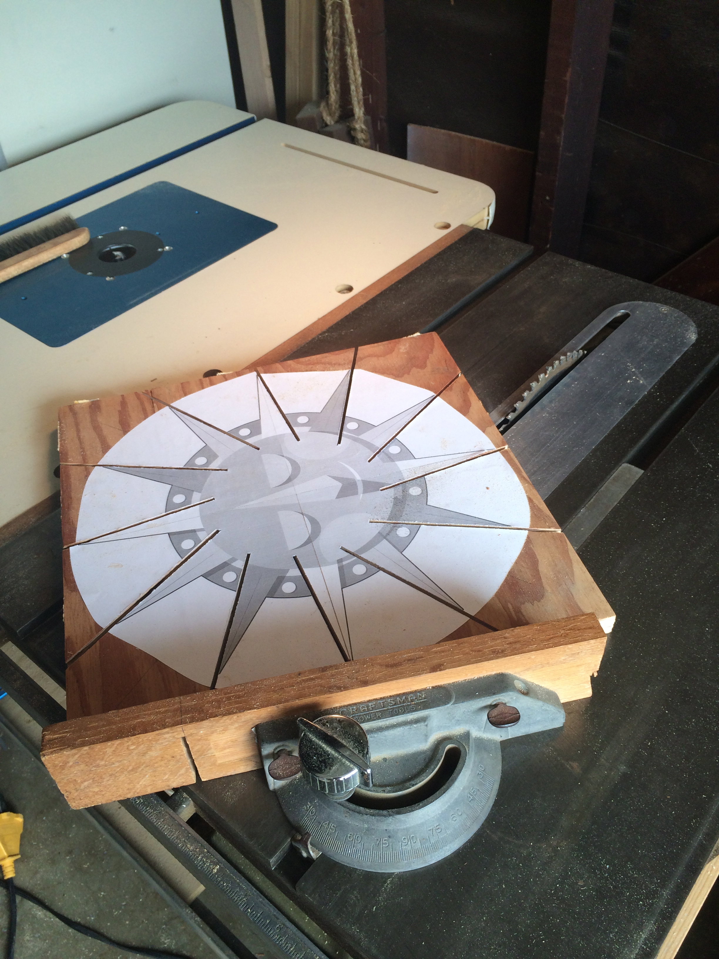  For the first prototype, I made router jigs for the sunburst shape and the various disks that make up the piece. 