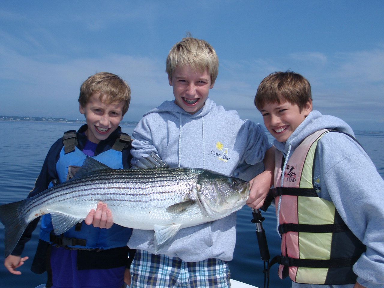 Image of a large striped bass caught in Kids fishing Camp off Marblehead