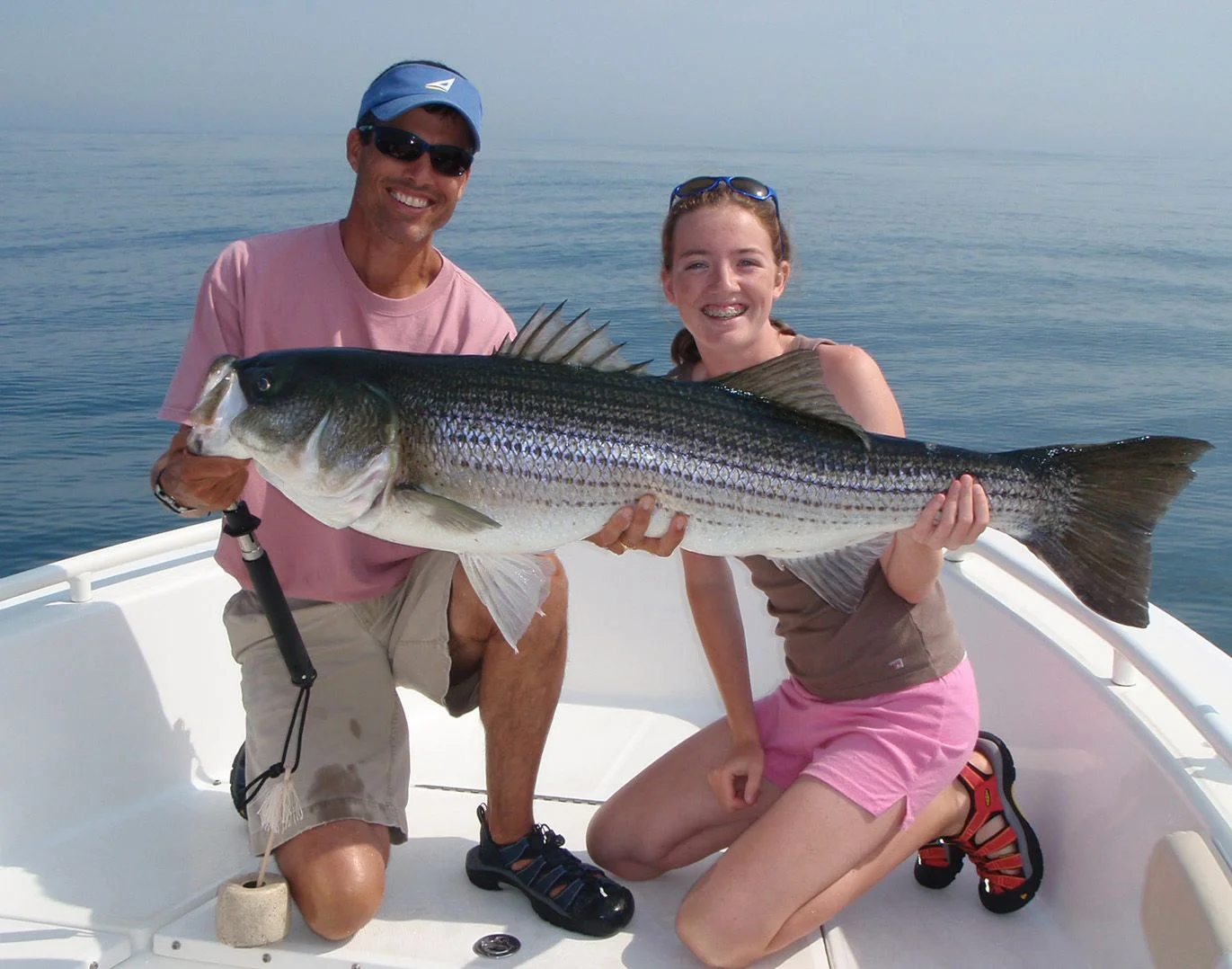 Image of Captain Randy Sigler with a large striped bass released off Marblehead