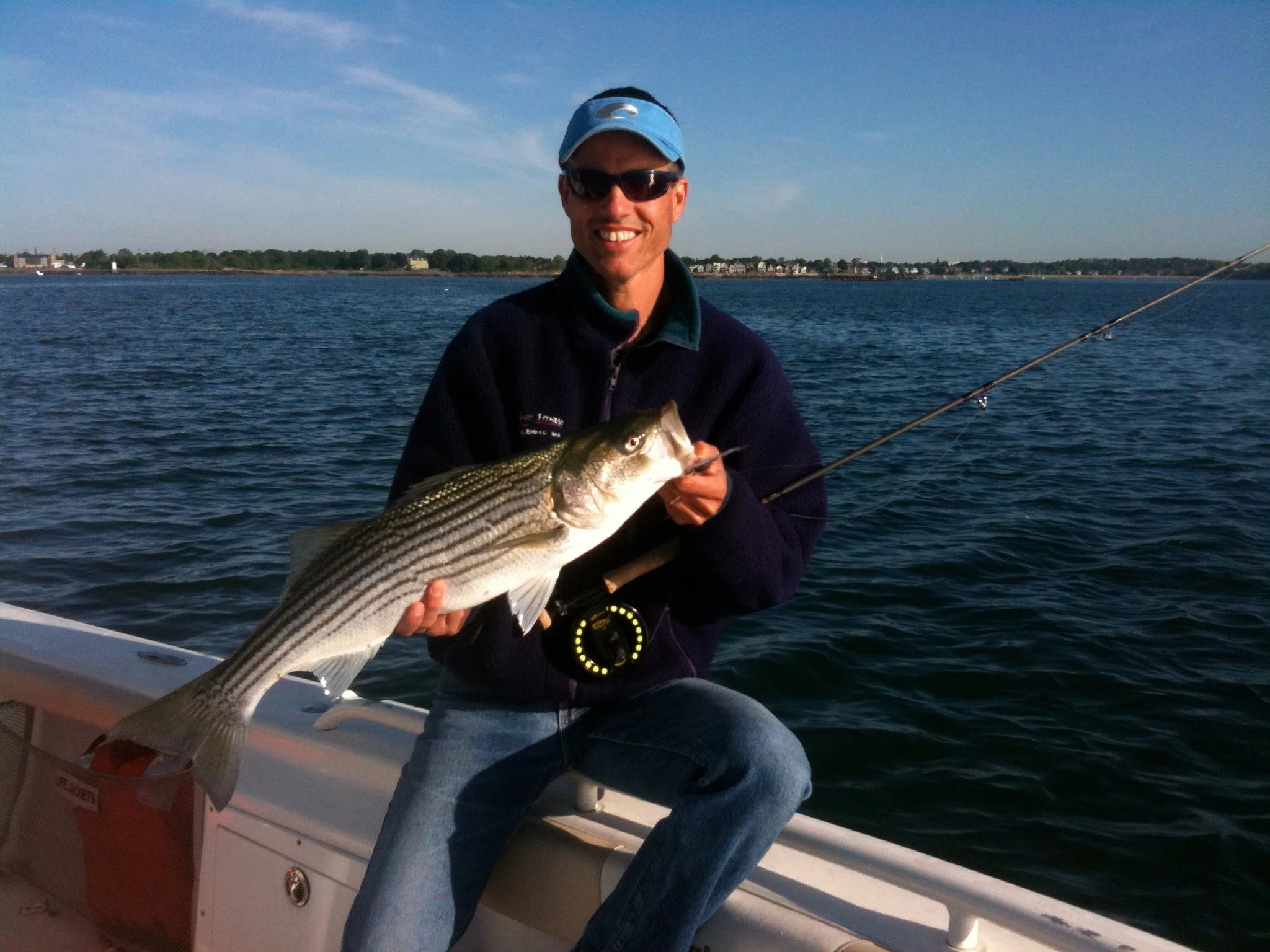 picture of a nice fly rod striped bass near Salem MA