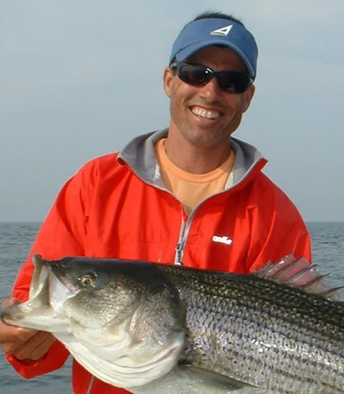 picture of top rated guide Randy Sigler with a nice striped bass released near Marblehead