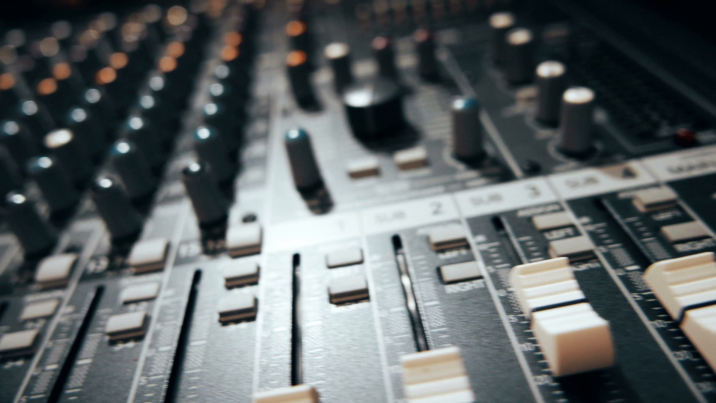 mixing-board-audio-knobs-pro-audio-mixing-board-faders-and-knobs-quick-slider-shot-across-multi-track-music-recording-equipment_btlo5_ll__F0000.png