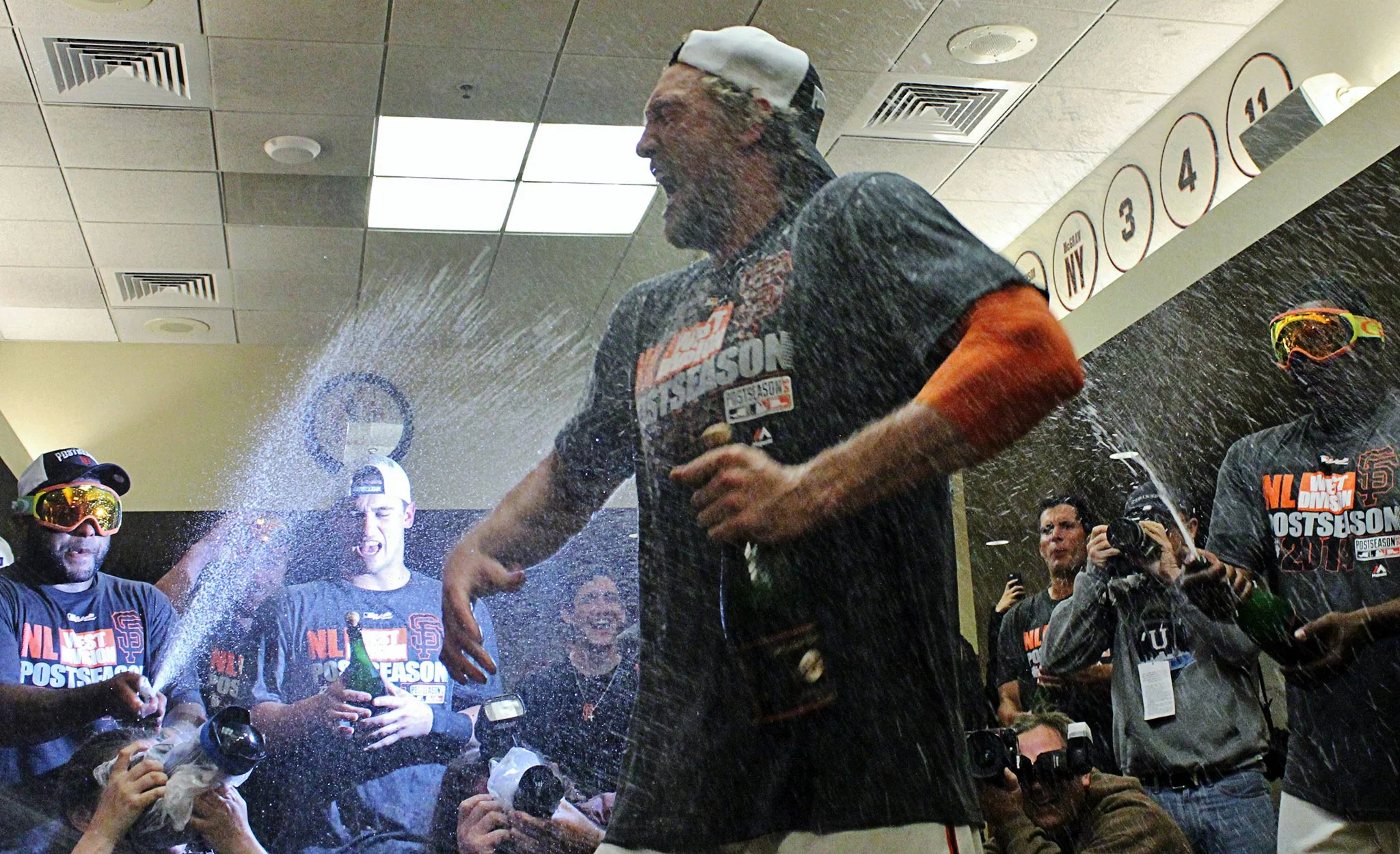 Hunter Pence celebrates the San Francisco Giants postseason berth in a champagne shower with his teammates in the Giants clubhouse after a game against the San Diego Padres at AT&T Park on Thursday, September 25, 2014 in San Francisco.