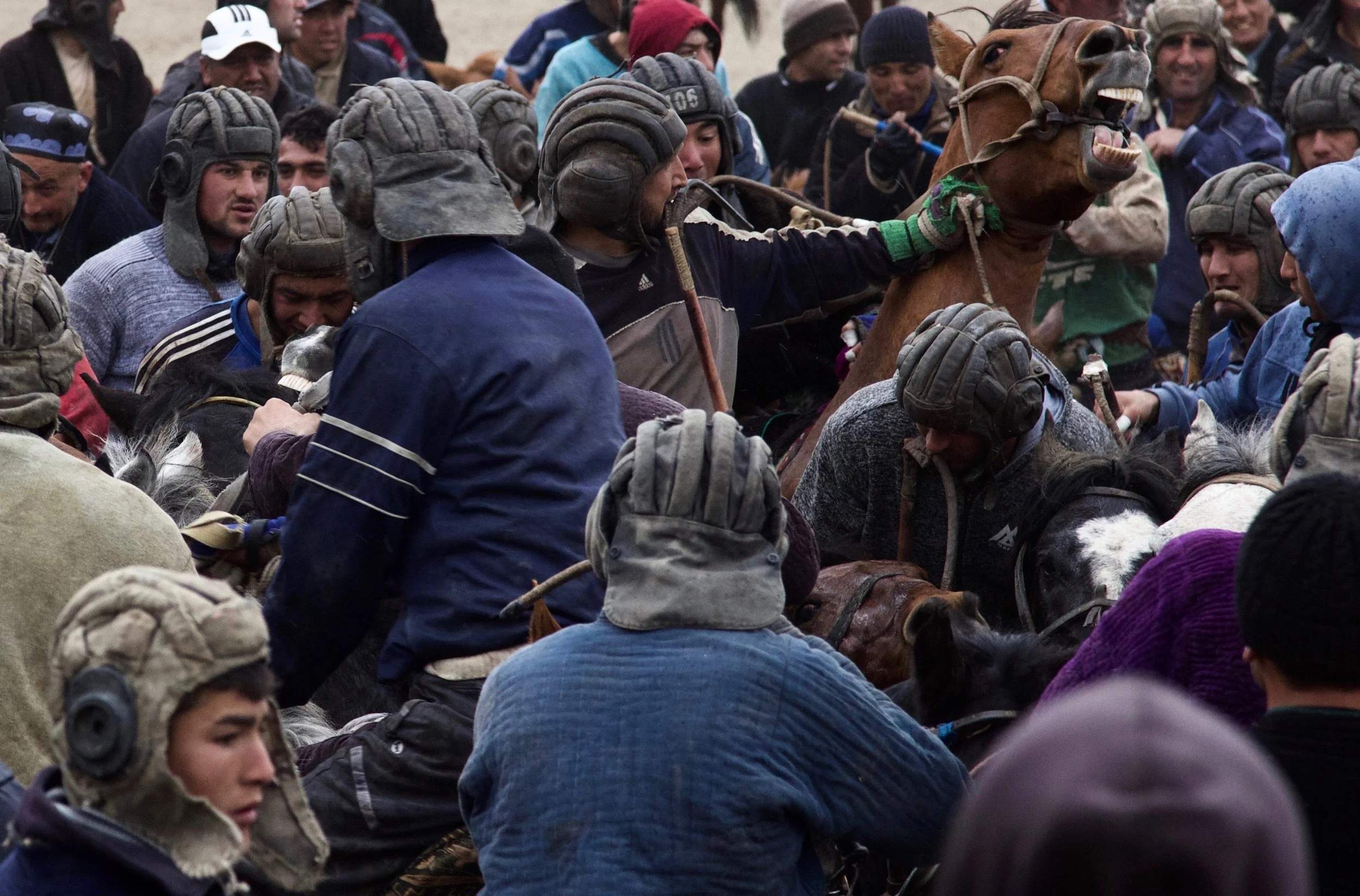 Buzkashi riders battle one another for possession of a goat during the Nowruz celebration in Regar, Tajikistan Tuesday, March 21, 2017.