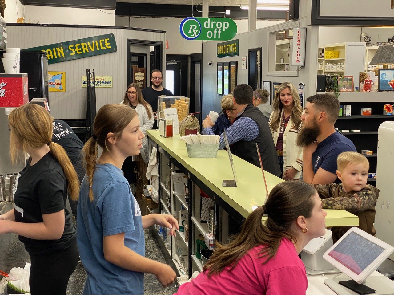 Butt Drugs’ staff works feverishly, serving ice cream, drinks and shakes during Butt Drugs’ last day of business on Saturday, April 29, 2023.