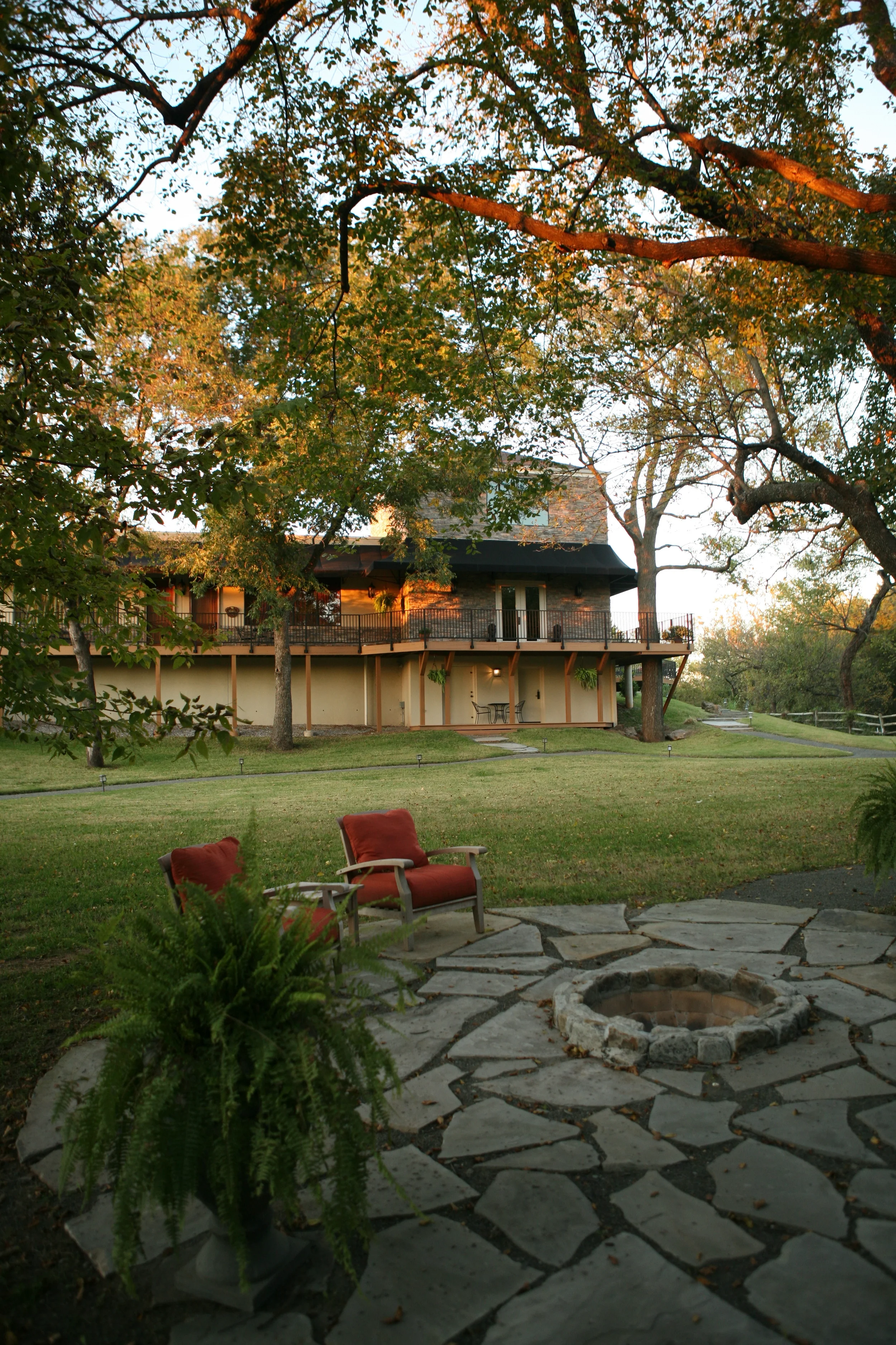 View of firepit and grounds behind Two Hearts