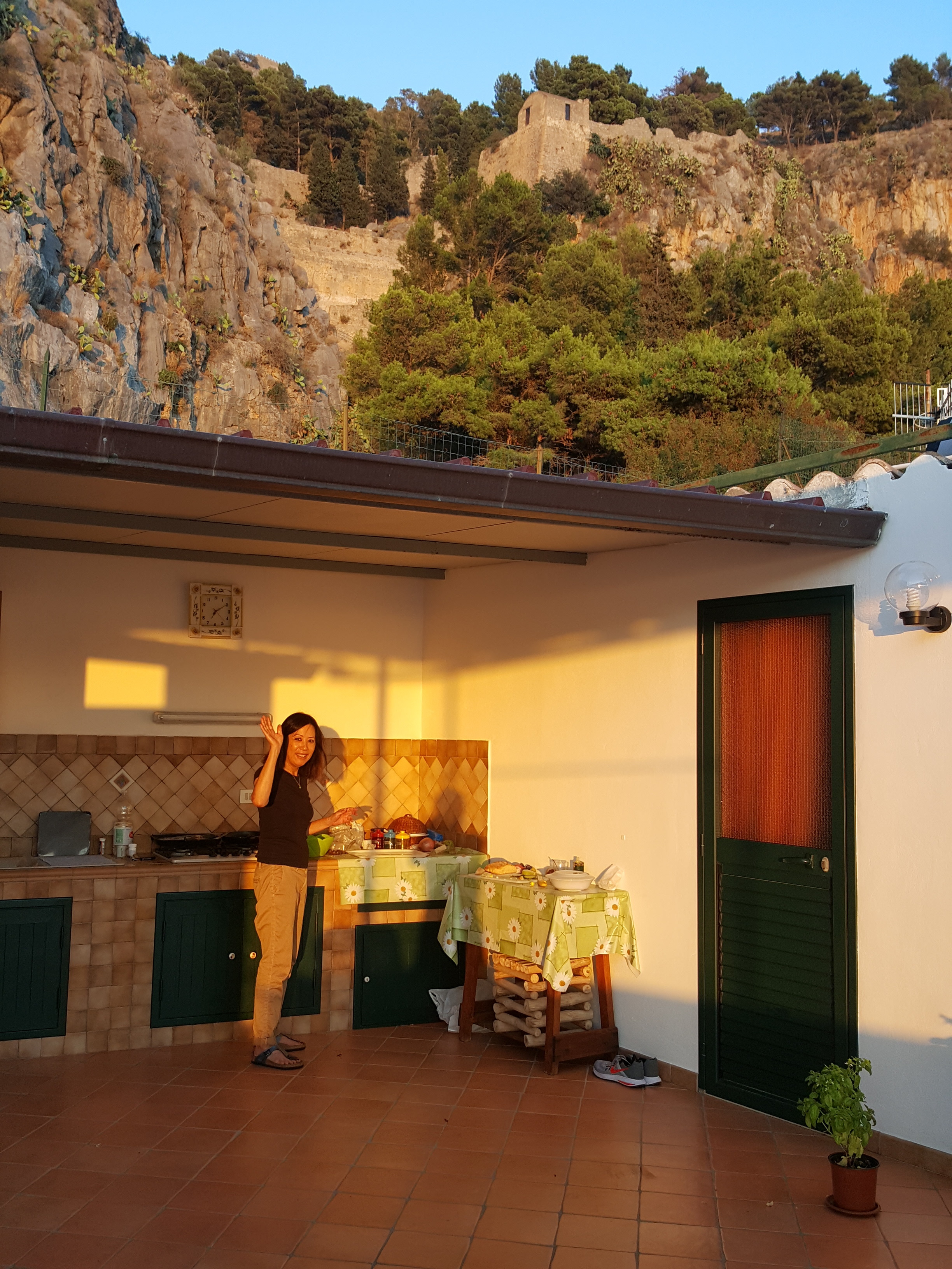 My mom doing her thing in our rooftop kitchen. La Rocca looms overhead.