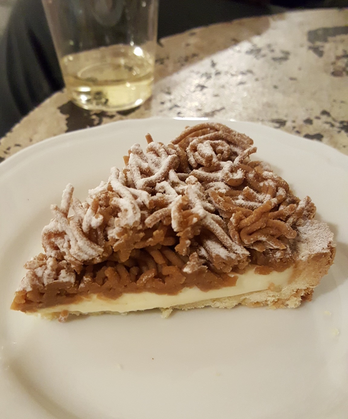 Sweet chestnut paste atop a light orange cream filled tart at S.Forno.