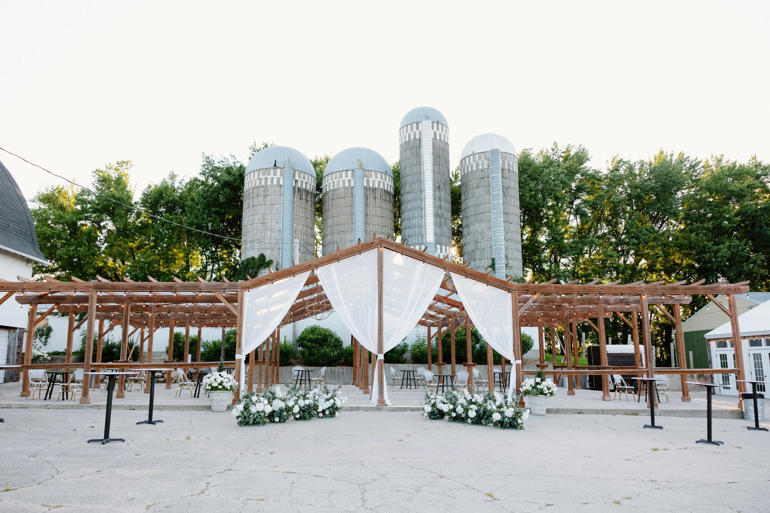 Outdoor pergola reception Minnesota wedding venue