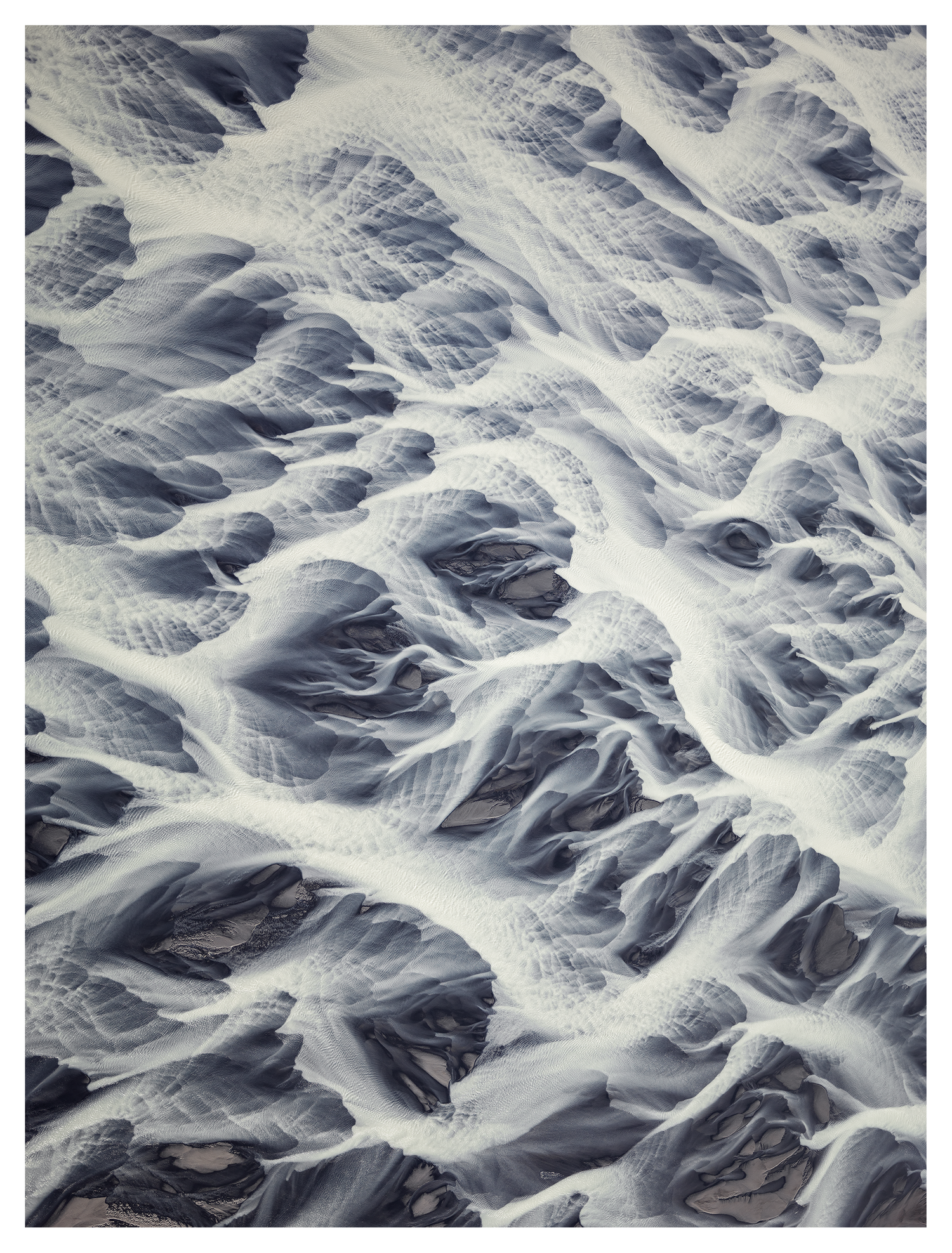 Natural Escher: pale, flowing patterns in an abstract landscape photograph by Matthias Kalt