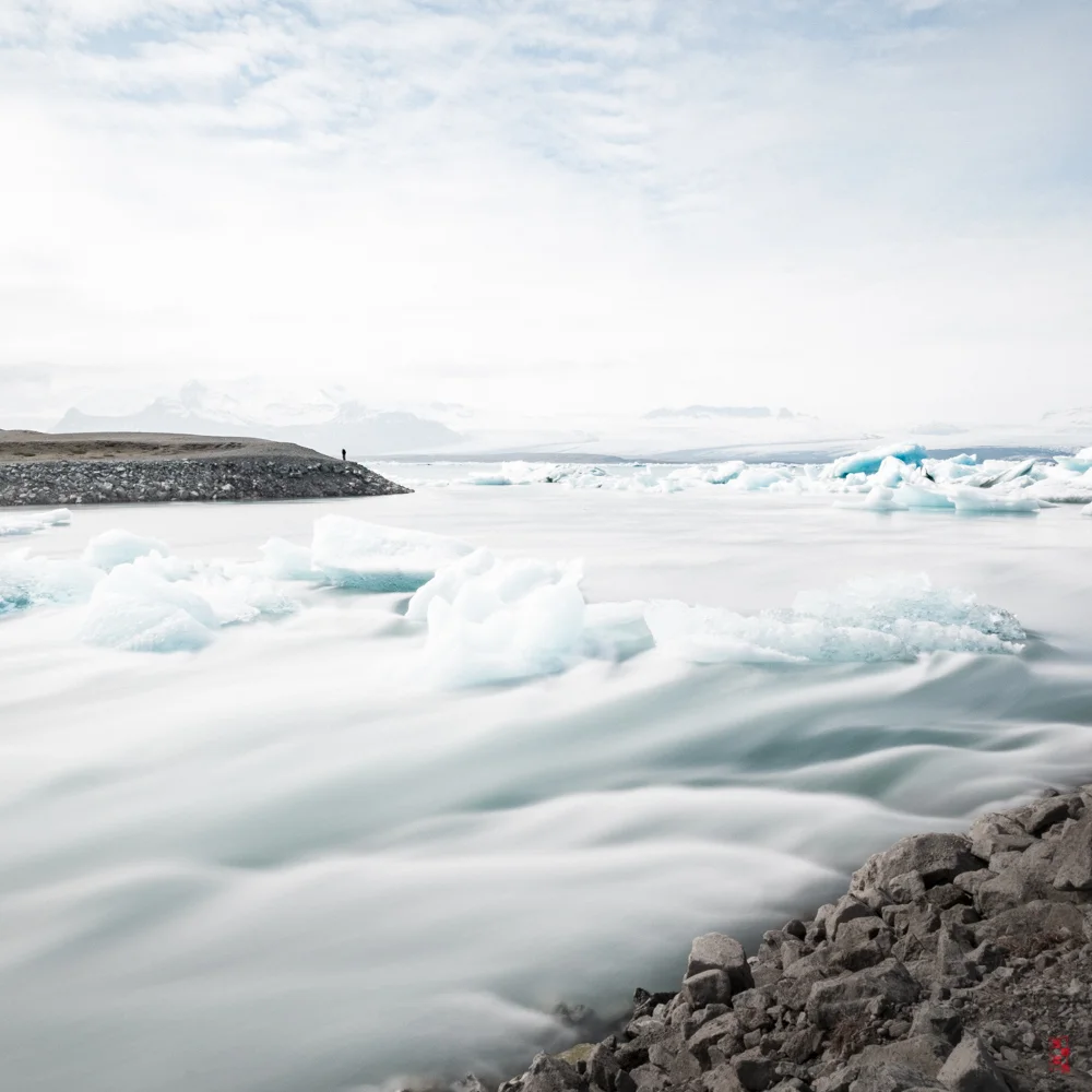 Water from Jökulsárlón streaming out at low tide.